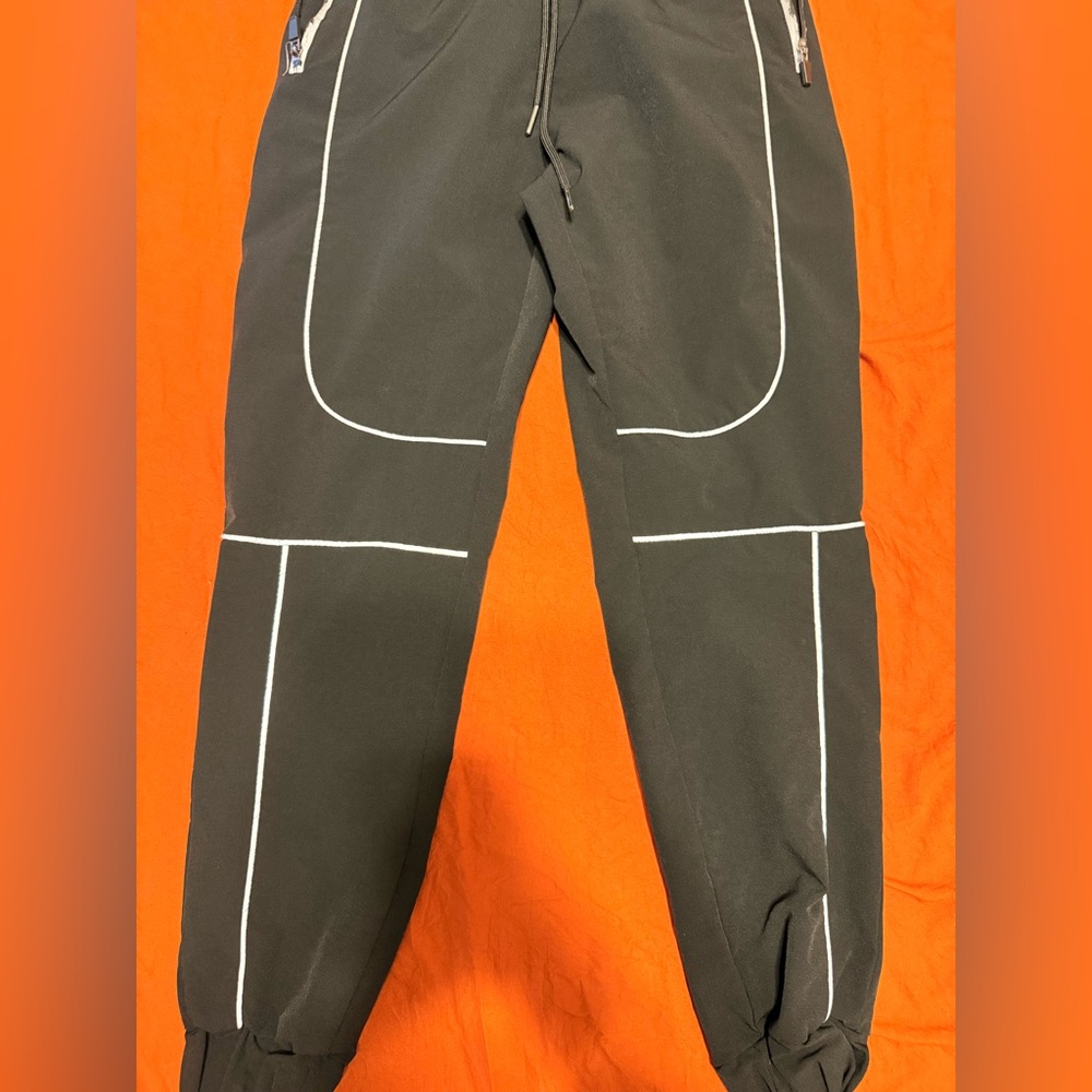 Sleek Black Joggers with Reflective Piping